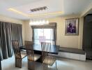 Modern dining room with a chandelier and contemporary furniture