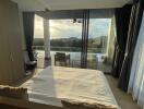 Bedroom with a view of the pool and scenic outdoor area