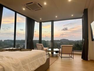 Bedroom with large windows and scenic view