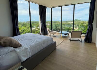 Spacious bedroom with a scenic view