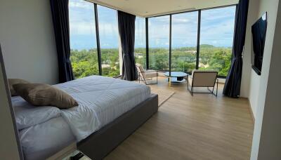 Spacious bedroom with a scenic view