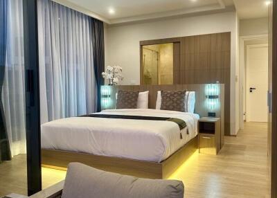 Modern bedroom with double bed and ambient lighting