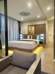 Modern bedroom with double bed and ambient lighting