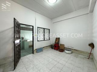 Unfurnished room with adjacent bathroom