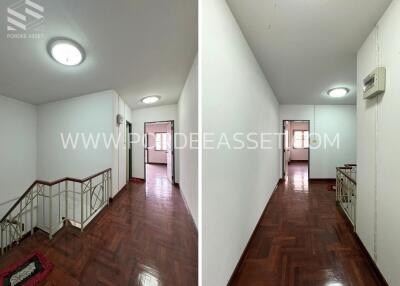 Interior corridor with wooden flooring and stair access