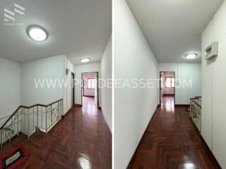 Interior corridor with wooden flooring and stair access