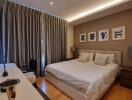 Modern bedroom with king-size bed and stylish decor