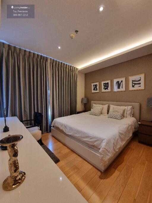 Modern bedroom with king-size bed and stylish decor