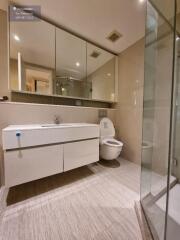 Modern bathroom with large mirrors and glass shower