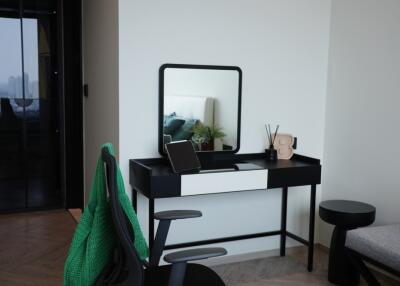 Modern bedroom with desk and mirror