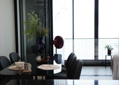 Modern dining area with large windows and a view