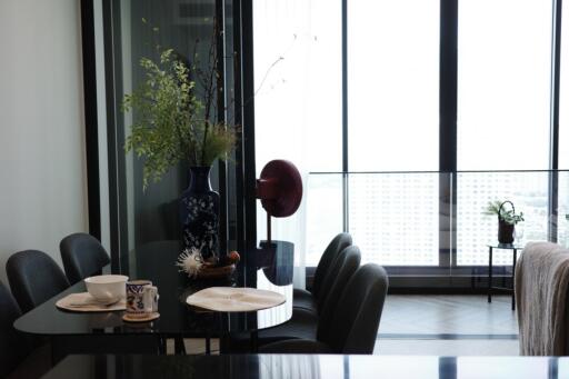 Modern dining area with large windows and a view