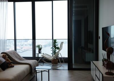 Modern living room with large windows and city view