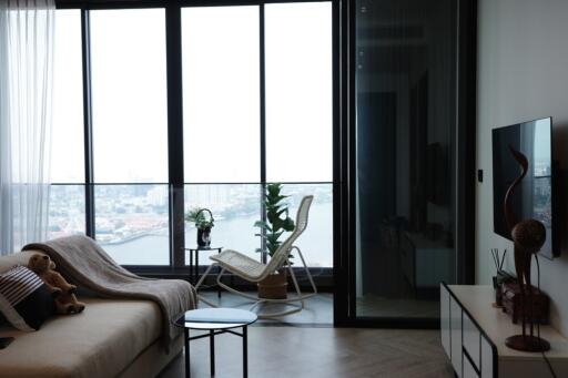 Modern living room with large windows and city view