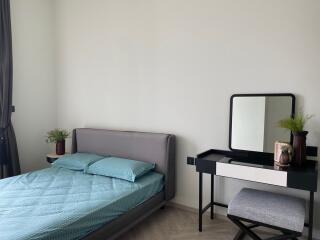 Bedroom with bed and vanity table