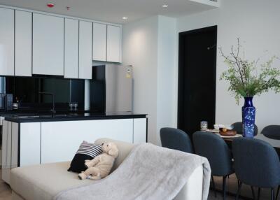 Modern living and dining area with minimalist kitchen