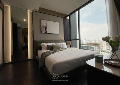 Modern bedroom with large windows