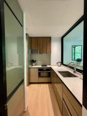 Modern kitchen with stainless steel appliances and wooden cabinets