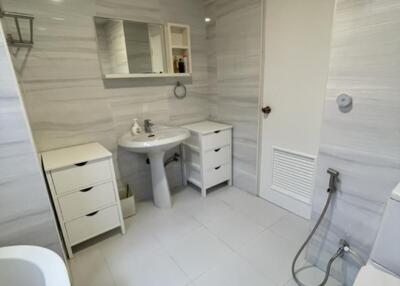 Modern bathroom with tiled walls and floors