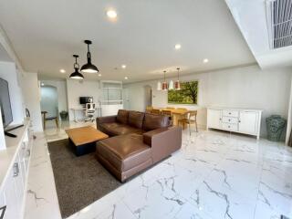 spacious living room with modern furniture and decor