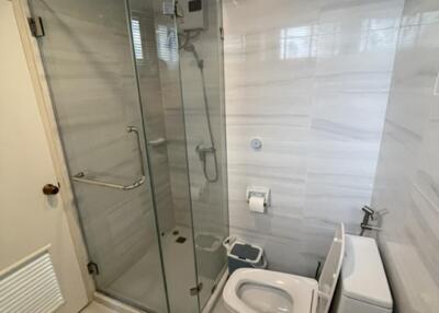 modern bathroom with glass shower and toilet