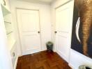 Bright hallway with wooden flooring and decor