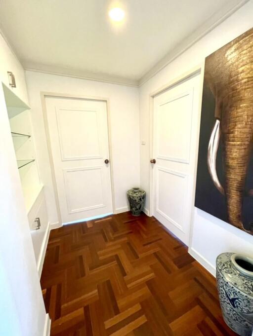 Bright hallway with wooden flooring and decor