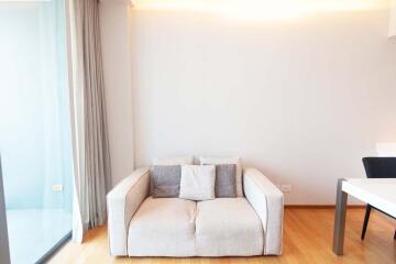 Bright living room with a beige sofa