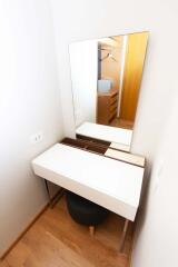 Modern small bedroom vanity with mirror and stool