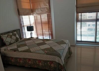 Cozy bedroom with natural light and blinds