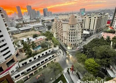 City skyline view at sunset with various buildings