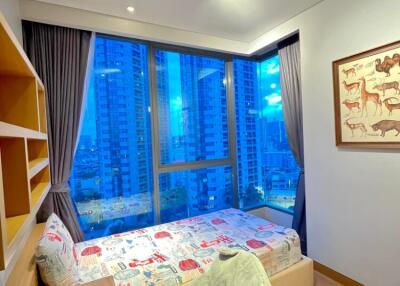 Modern bedroom with large window and city view