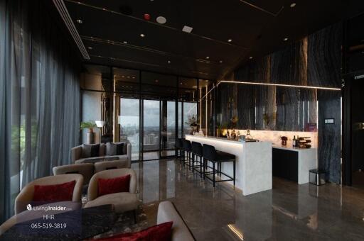 Modern living room with a bar area and panoramic city view