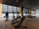 Residential building gym with modern equipment and city view