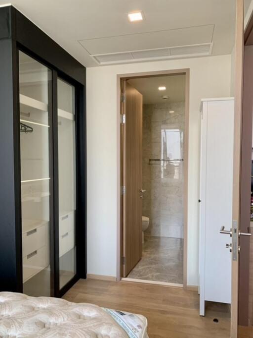 Bedroom with view of closet and bathroom