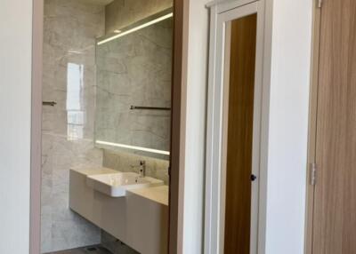 Modern bathroom with a large mirror and vanity