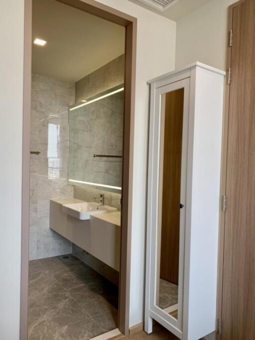 Modern bathroom with a large mirror and vanity