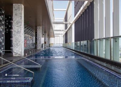 Indoor pool area with city view