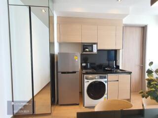 Modern kitchen with appliances and washer/dryer