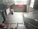 Lobby area with escalator and UFM Fuji Super sign