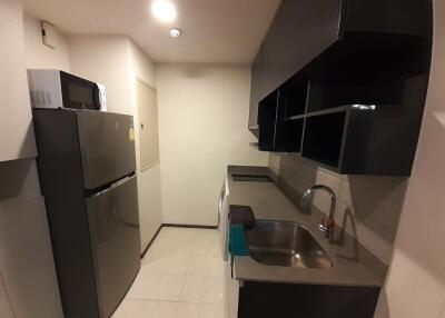 Modern kitchen area with stainless steel appliances