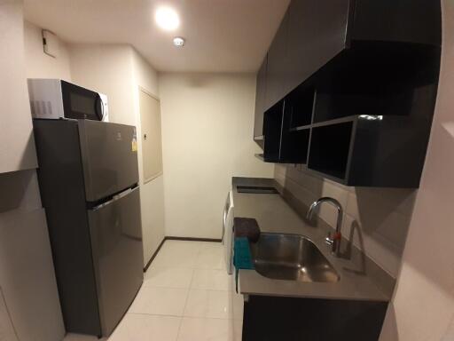 Modern kitchen area with stainless steel appliances