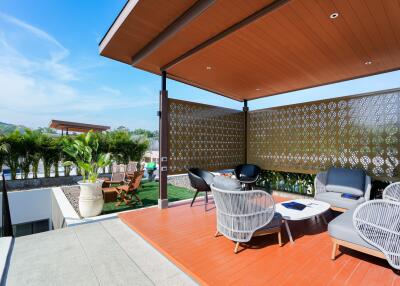 Modern outdoor patio with seating area and pergola