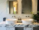 Modern bathroom with double sinks and marble finishes