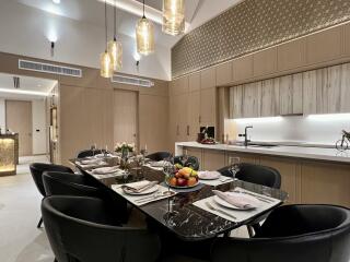 Modern kitchen with dining area and stylish lighting