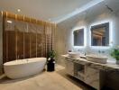 Modern bathroom with double vanity, bathtub, and accent lighting