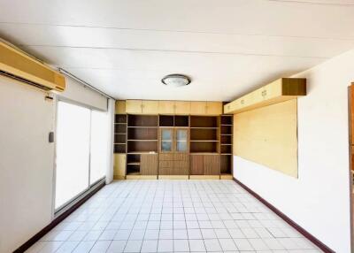 Living room with shelves and cabinets