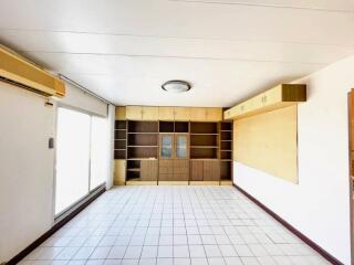 Living room with shelves and cabinets