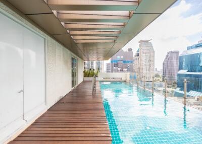 Rooftop pool area with city view