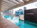 Modern rooftop pool with city skyline view